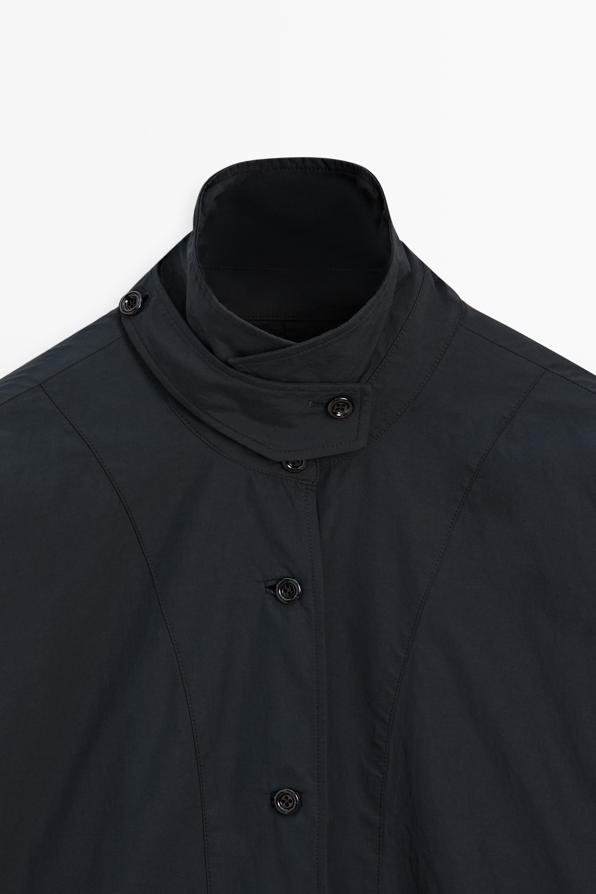 Veste-cape col patte boutonnée